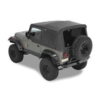 Bestop Supertop NX soft top in Black Denim with tinted windows and black hardware installed on a Jeep Wrangler YJ.
