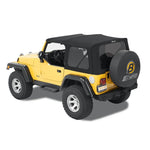 Bestop Supertop soft top in Premium Black Twill with Sunrider panel on a Jeep Wrangler TJ.