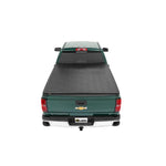 Bestop EZRoll soft roll-up tonneau cover mounted on a 6.5-foot Chevrolet C/K Fleetside truck bed.