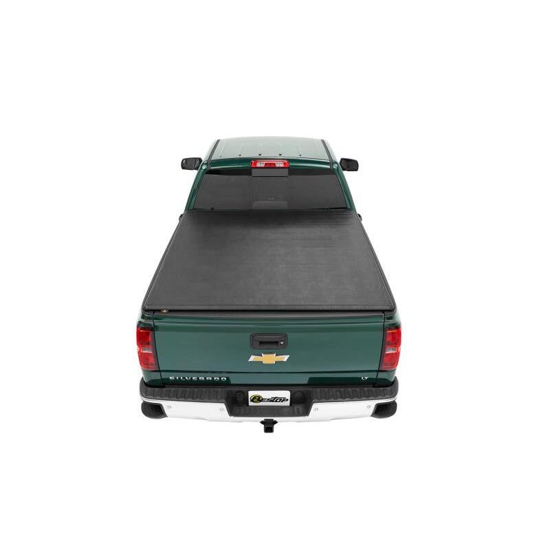 Bestop EZRoll soft roll-up tonneau cover mounted on a 6.5-foot Chevrolet C/K Fleetside truck bed.