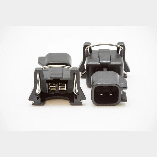Set of four BLOX Racing fuel injector harness adapters for Bosch to OBD1 conversion with black connectors.