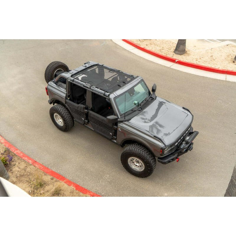 Body Armor 4x4 black mesh sunshade top installed on a 2021-2024 Ford Bronco.