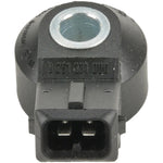 Bosch engine knock sensor featuring a black polymer housing with a central metal mounting bore and electrical connector.