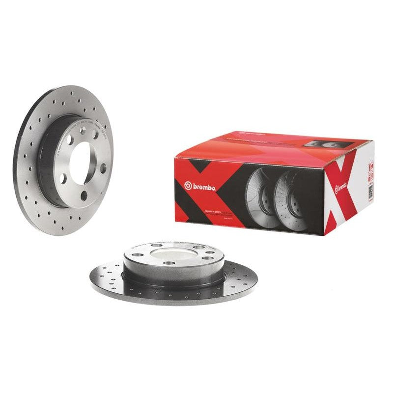Cross-drilled Brembo Premium Xtra front brake rotor with silver UV coating and mounting hardware.