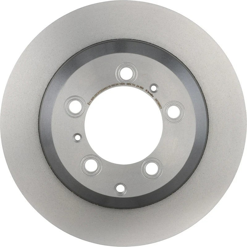 Brembo UV coated high carbon front brake rotor for 2019-2024 Porsche Cayenne showing the protective grey coating.