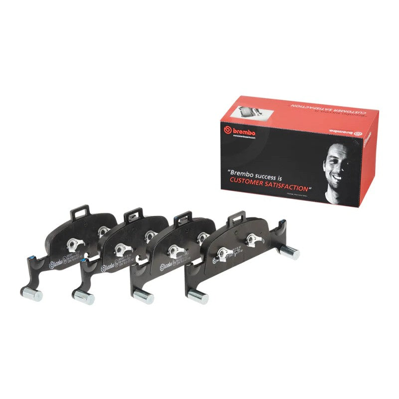 Brembo P85164 Low-Met premium brake pad set with noise-reducing shims for Audi performance braking.