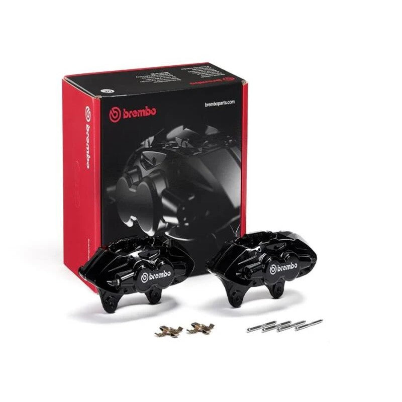 Pair of black Brembo X-Style hydraulic front brake calipers with installation pins and springs.