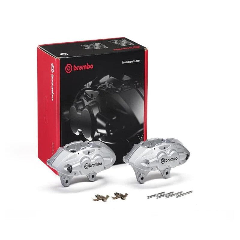 Pair of silver Brembo X-Style front hydraulic brake calipers with installation pins and springs
