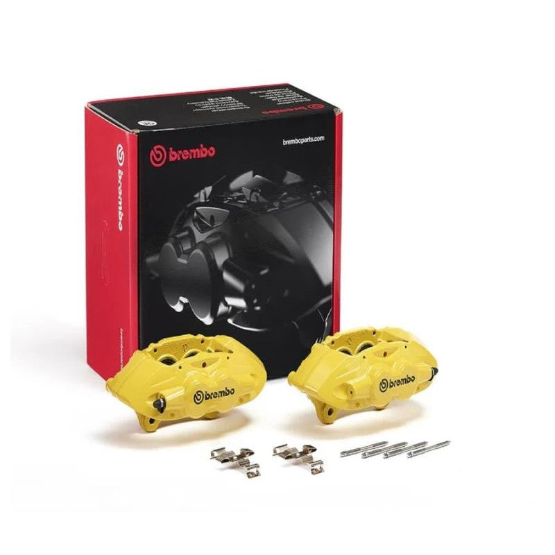 Pair of yellow Brembo X-Style hydraulic front brake calipers with included installation pins and springs.