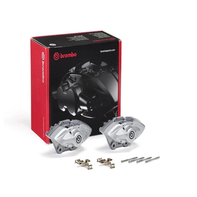 Pair of silver Brembo X-Style rear hydraulic brake calipers with installation pins and springs.
