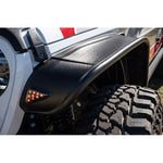 Four-piece set of Bushwacker Flat Style Fender Flares in matte black for Jeep Gladiator with LED side markers.