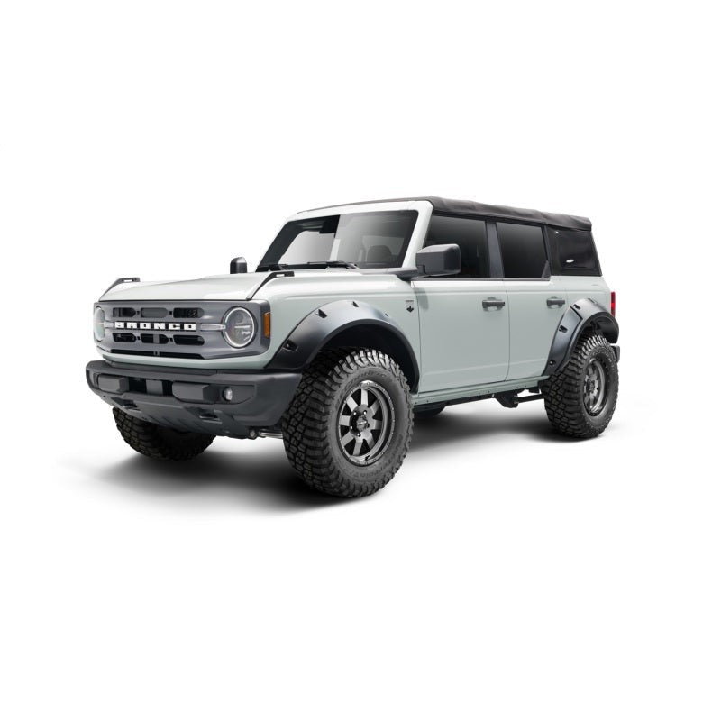 Four Bushwacker matte black Pocket Style fender flares with recessed stainless steel bolts for a 2021-2025 Ford Bronco.