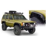 Bushwacker matte black Flat Style Fender Flares for 1984-2001 Jeep Cherokee XJ with LED side marker lights.