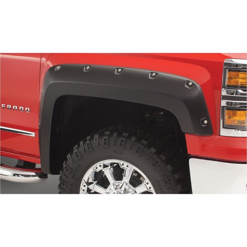 Four matte black Bushwacker Pocket Style fender flares with stainless steel bolts for 1986-1995 Suzuki Samurai.