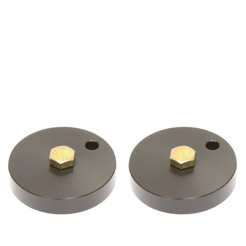 Anodized gray billet aluminum front bump stop drop pucks with Grade 8 mounting bolts for Ford Super Duty trucks.