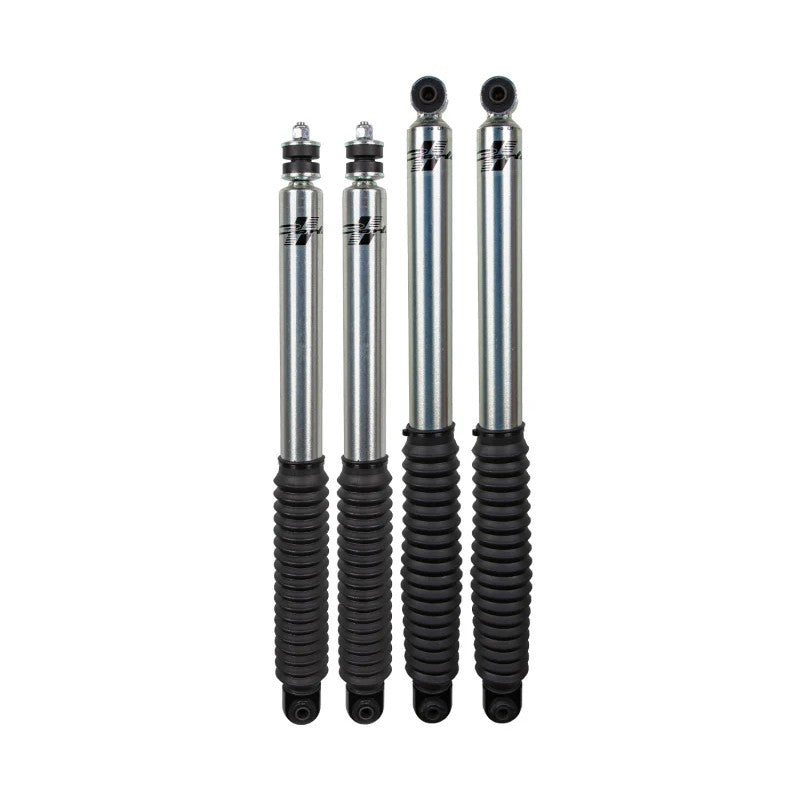 Carli Signature Series 2.0 rear shocks for 2005-2023 Ford Super Duty with clear coat finish and rubber boots.
