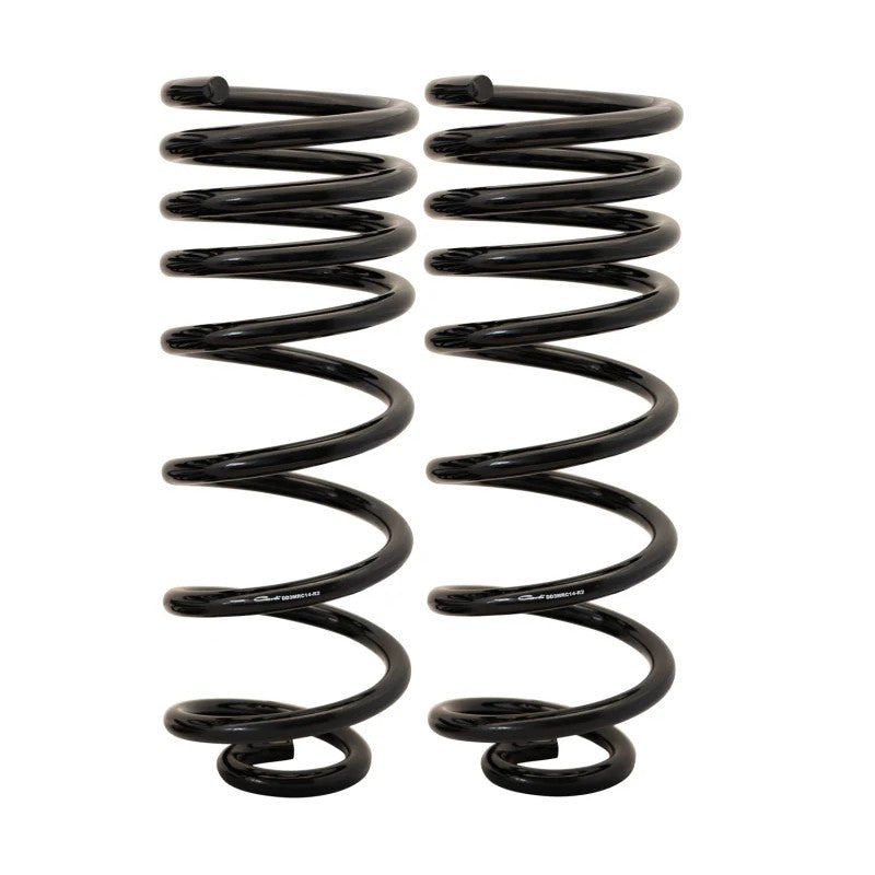 A pair of heavy-duty black powder-coated Carli multi-rate rear lift coil springs for 2014-2023 Ram 2500 trucks.
