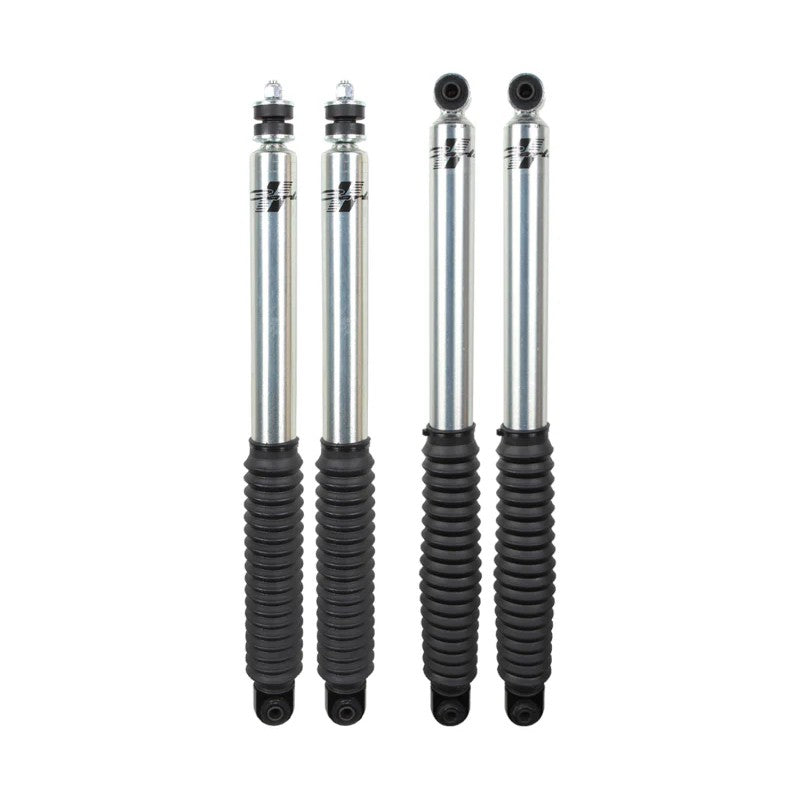 Carli Suspension Signature Series 2.0 front and rear shock absorbers with clear-coated bodies and black rubber boots.