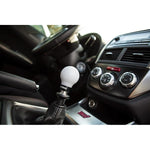 Cobb white 6-speed shift knob with stealth black collar and engraved shift pattern.