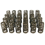 Set of 16 COMP Cams Beehive valve springs with oval wire construction and 1.445-inch outer diameter.