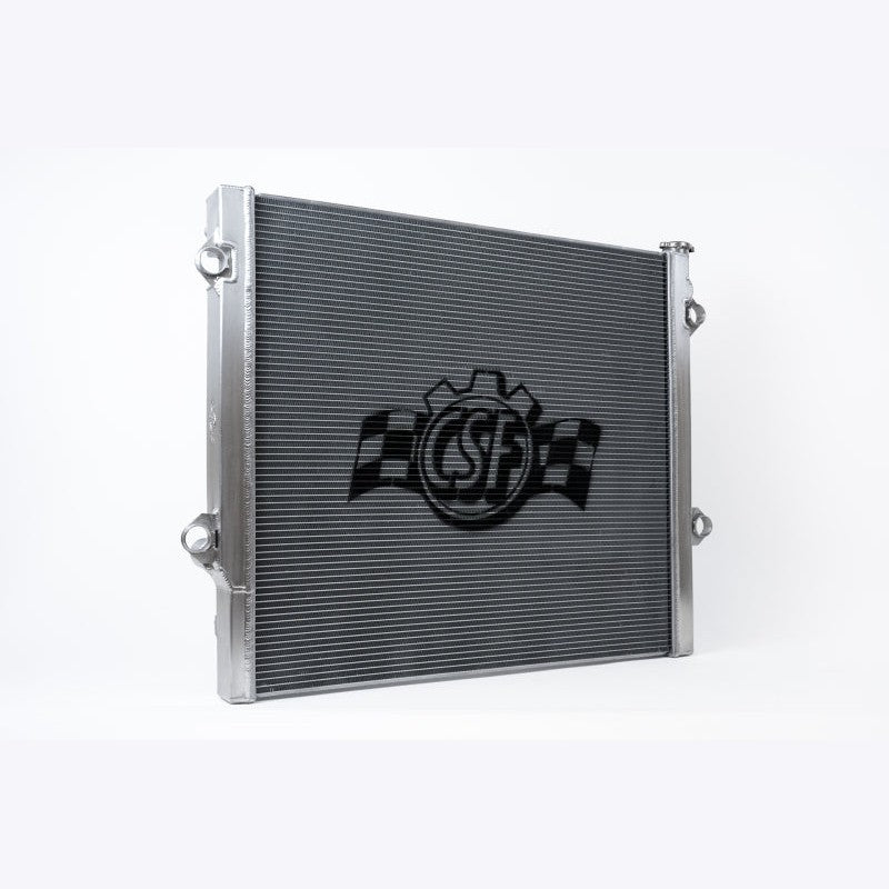 CSF 7215 all-aluminum 2-row radiator with TIG-welded tanks and integrated 5-plate transmission oil cooler.