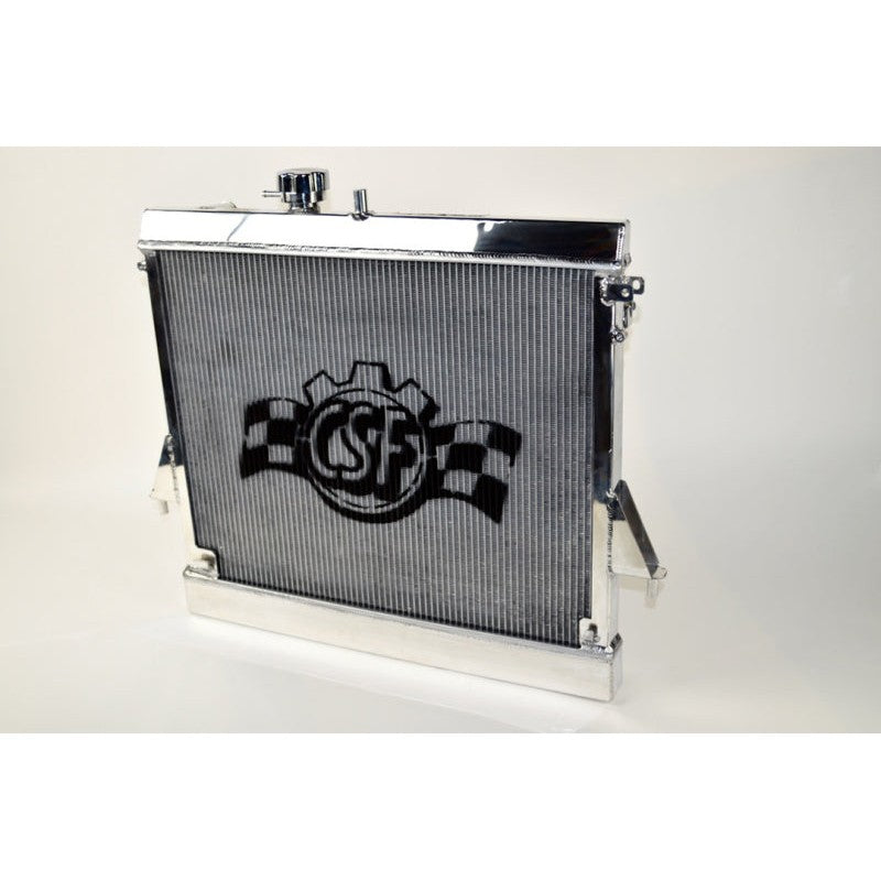 Polished all-aluminum CSF 7061 radiator featuring 2-row core and CNC machined quick-connect fittings.