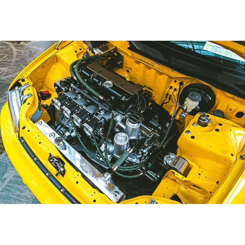 Mirror-polished CSF 2850K V3 all-aluminum 2-row radiator with CNC-machined fittings for K-swapped Civic and Integra.