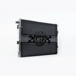Polished aluminum CSF 8215 front mount heat exchanger with protective black mesh rock guards and mounting brackets.