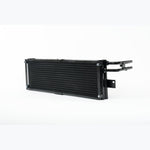 CSF dual-core aluminum transmission oil cooler featuring a protective rock guard and OEM quick-connect ports.