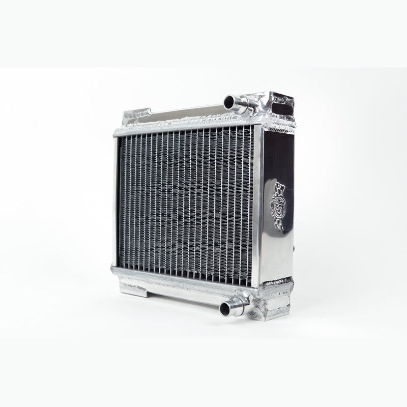 Polished aluminum CSF auxiliary radiator with B-Tube core and black mesh rock guard.