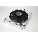 Mirror-polished CSF 2858X aluminum half radiator with 12-inch SPAL cooling fan, shroud, and -16AN fittings.