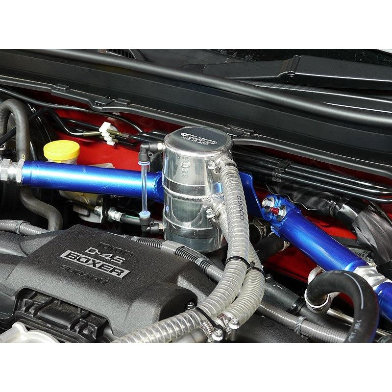 Cusco blue anodized separator type oil catch tank with mounting brackets and hoses for ZC6 and ZN6 chassis.