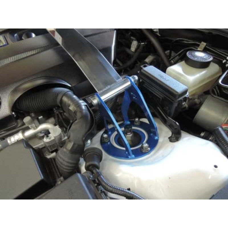 Cusco OS Type polished aluminum front strut tower bar with blue steel brackets for Lexus RC and GS F models.