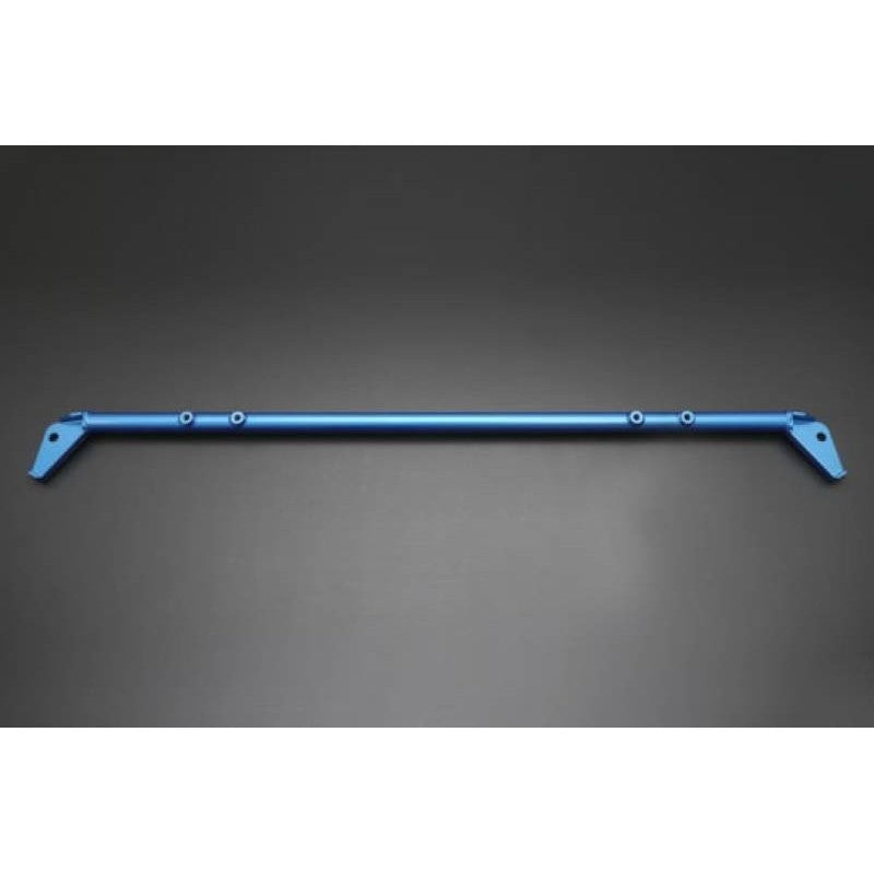 Blue Cusco Power Brace Trunk Harness Bar installed in the rear of a Toyota Supra A90.
