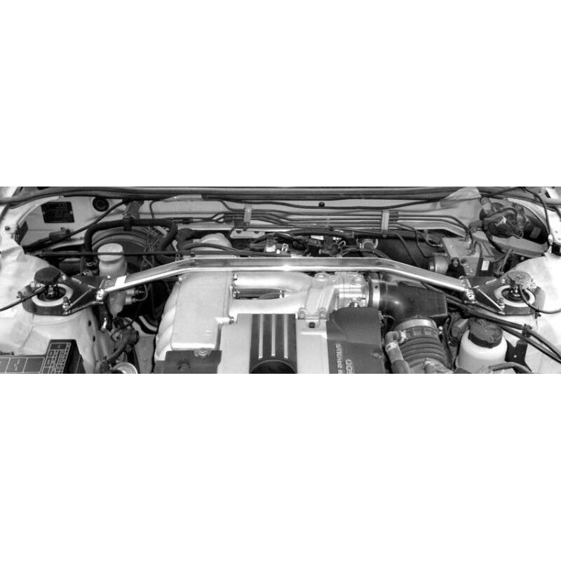 Polished oval aluminum Cusco Type OS front strut tower bar with blue steel end plates for R33 and R34 Nissan Skyline.