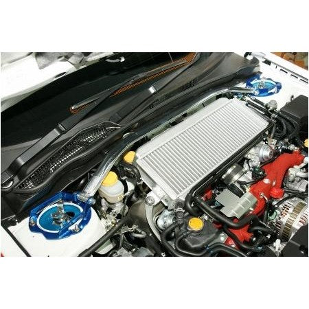 Cusco Type OS front strut tower bar with a silver oval aluminum shaft and blue powder-coated steel brackets.