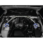 Cusco Type OS Front Strut Tower Bar for 2016 Mazda Miata ND5RC featuring an oval aluminum shaft and blue steel brackets.