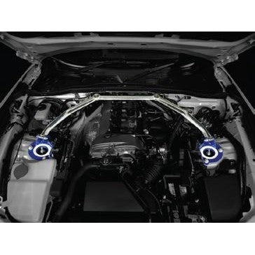Cusco Type OS Front Strut Tower Bar for 2016 Mazda Miata ND5RC featuring an oval aluminum shaft and blue steel brackets.