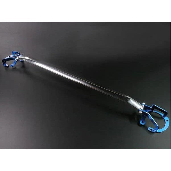 Cusco Type OS front strut tower bar featuring a polished oval aluminum shaft and blue steel mounting brackets.
