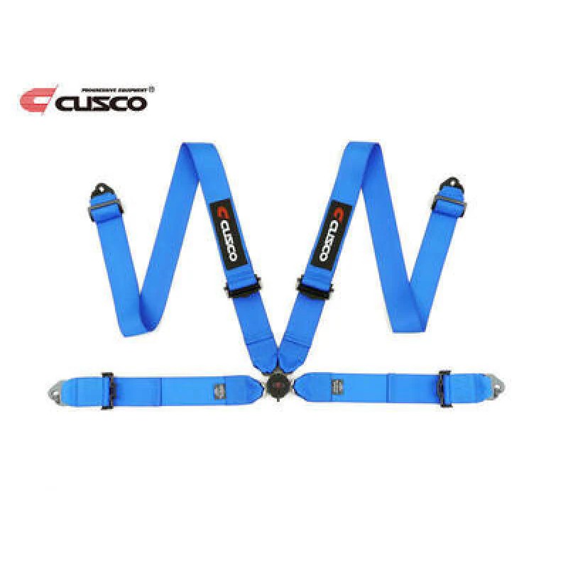 Cusco 4-point racing harness featuring 3-inch wide blue webbing and heavy-duty buckle hardware.