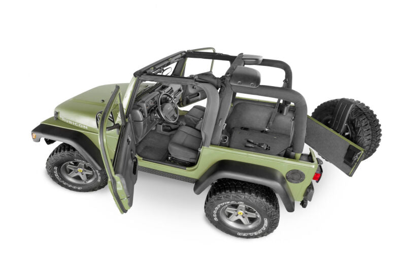 Husky Liners Guardian Impact textured black floor and cargo liner installed in a Jeep Wrangler TJ interior.