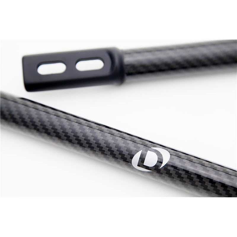 Dinan carbon fiber front strut tower brace with black powder-coated forged aluminum ends for E9X BMW M3.