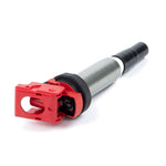 Red Dinan high output ignition coil with white logo for BMW and Mini performance engines.