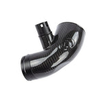 Dinan gloss carbon fiber turbo inlet pipe with integrated CNC machined fittings for BMW B58 engines.