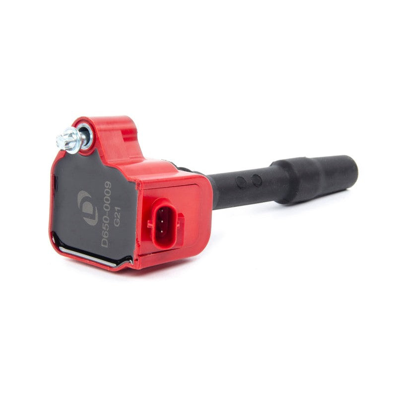 Red Dinan performance ignition coil featuring a black connector top and white Dinan logo