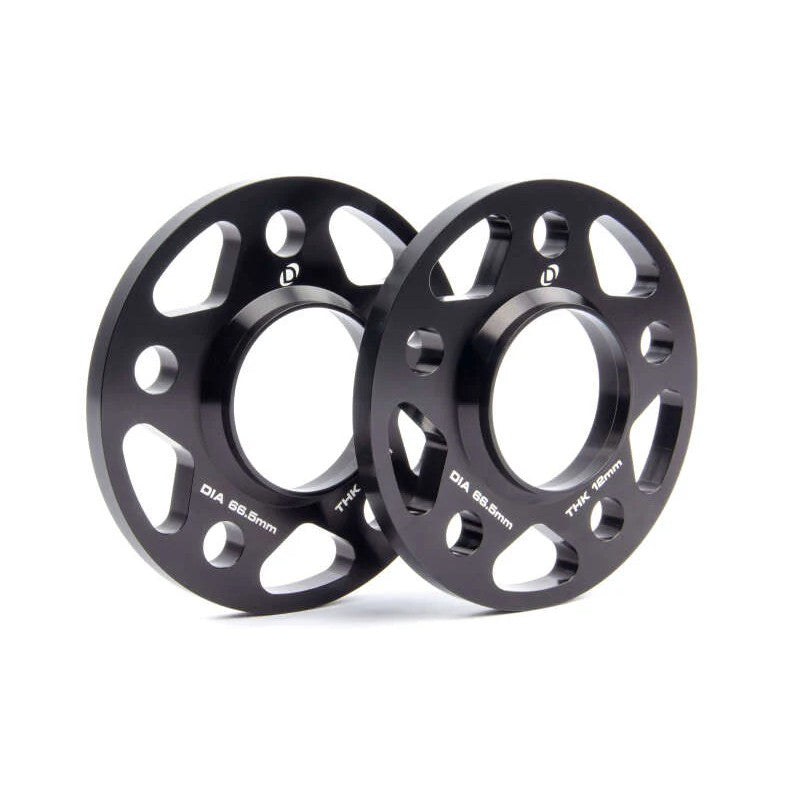 Pair of black anodized Dinan 12mm hub-centric wheel spacers with 5x112 bolt pattern and 66.5mm center bore.