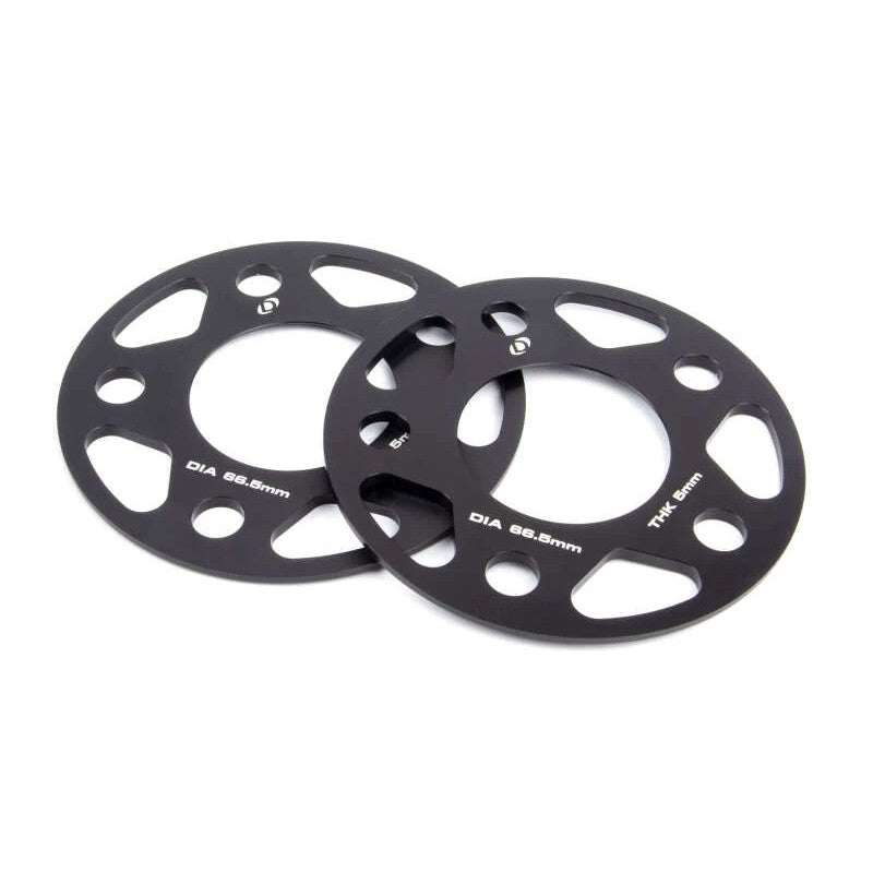 Set of two Dinan 5mm black anodized aluminum wheel spacers with 5x112 bolt pattern and 66.5mm center bore.
