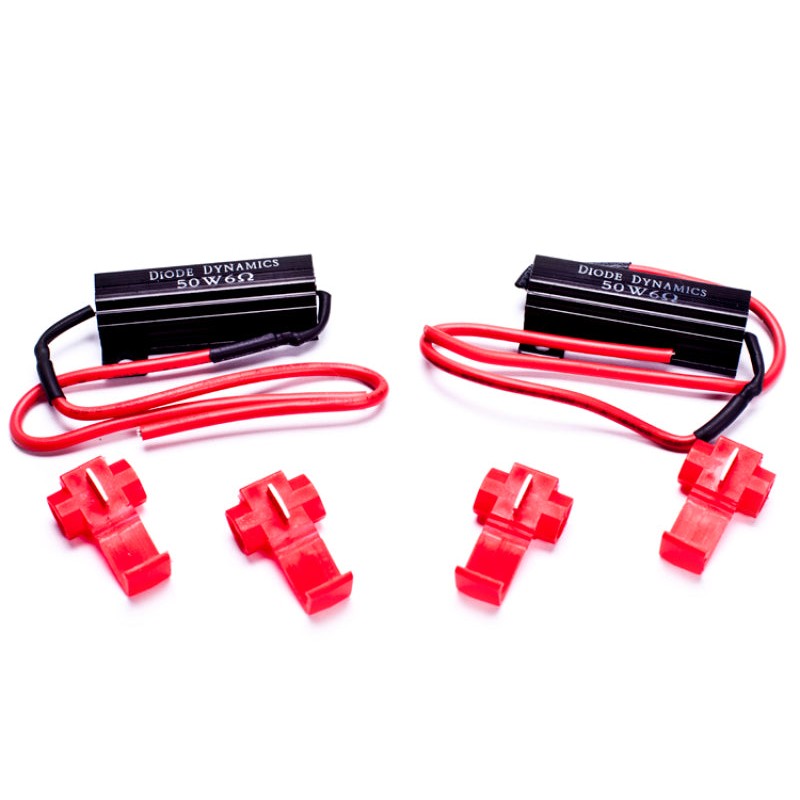 Pair of gold-anodized Diode Dynamics LED load resistors with wire leads and blue T-tap connectors.