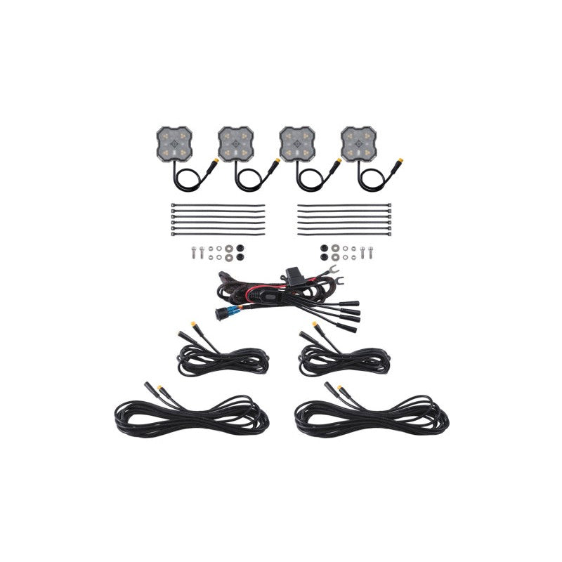 Four Diode Dynamics Stage Series dual-color Amber/White LED rock lights showing M8 center bolt and wide-angle lenses.