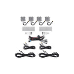 Four Diode Dynamics Stage Series dual-color Amber/White LED rock lights showing M8 center bolt and wide-angle lenses.